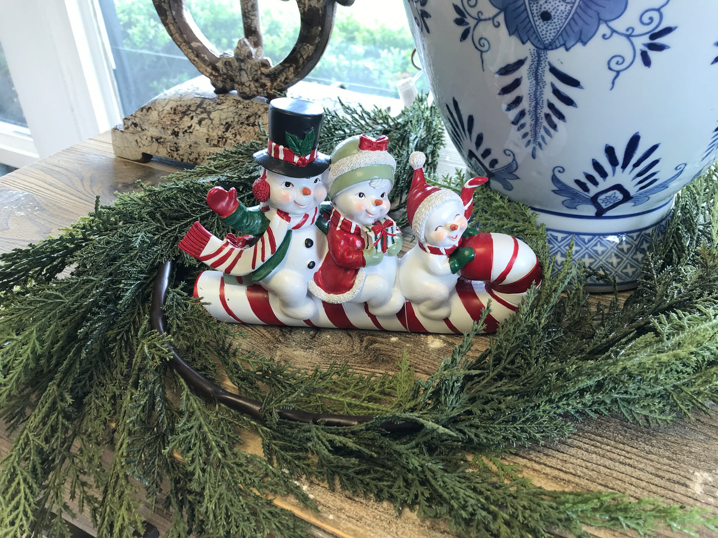 Snowman Family on Candy Cane 8"L x 5"H Resin